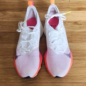 Nike White and Pink Athletic Shoes Lightweight Knit Design
